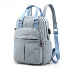Travel Backpack Purse | USB Charging Port & Waterproof Nylon
